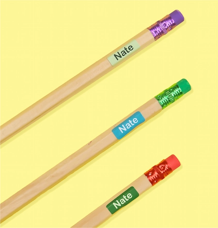 Small name labels on three pencils